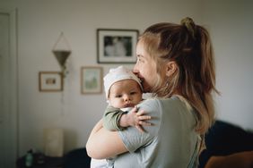 parent holding small baby